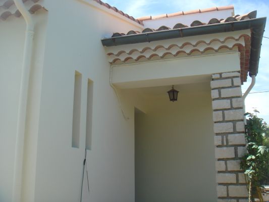 Ravalement d'une façade à Marignane d'une maison de ville